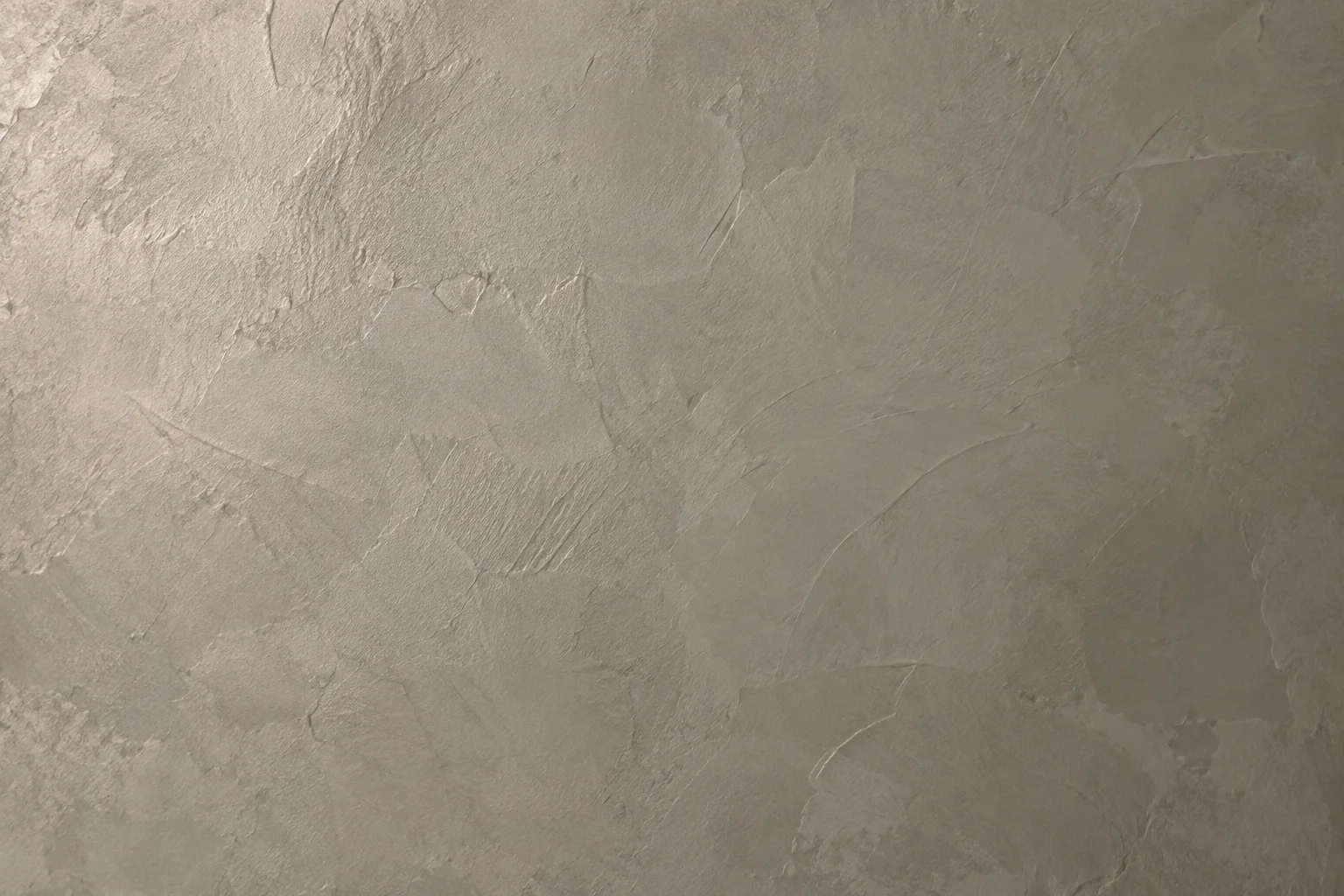 Illustrative close-up of warm grey Venetian plaster with natural hand-troweled variation